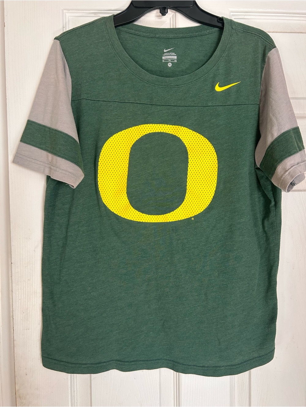 Nike Green Kids Tee with Yellow 'O' Logo and Gray Sleeve Accents